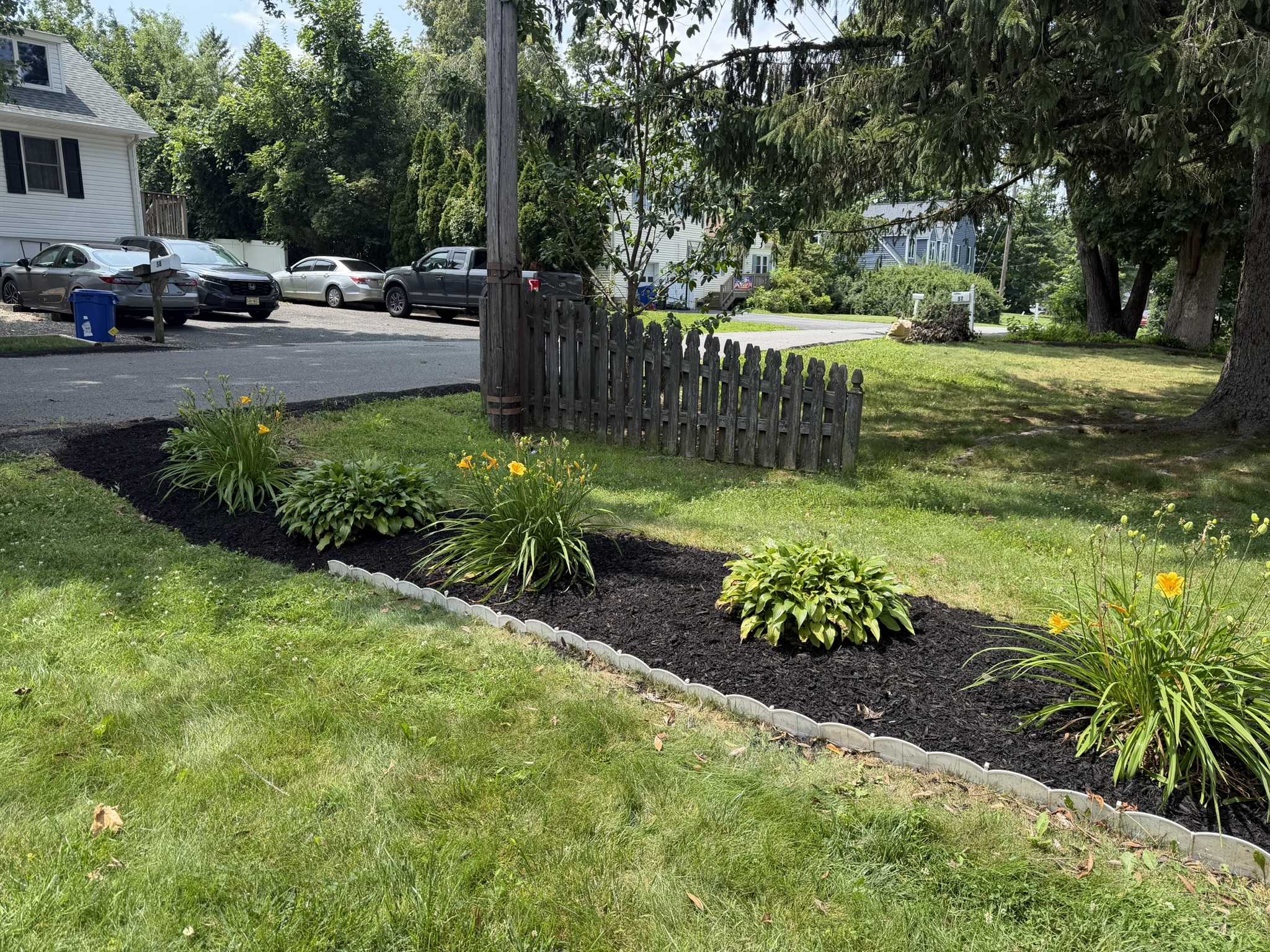 Garden improvements with structured shrubs and mulched beds